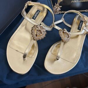 Dolce & Gabbana gold slides .. never worn